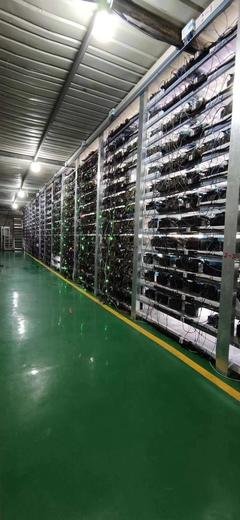High-tech mining farm with rows of mining rigs hashing away