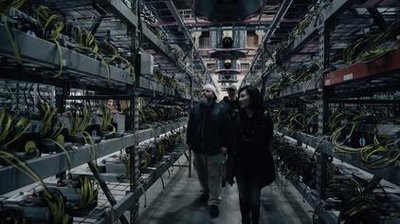 An aerial view of a sprawling mining farm, showcasing rows upon rows of mining rigs and efficient cooling systems
